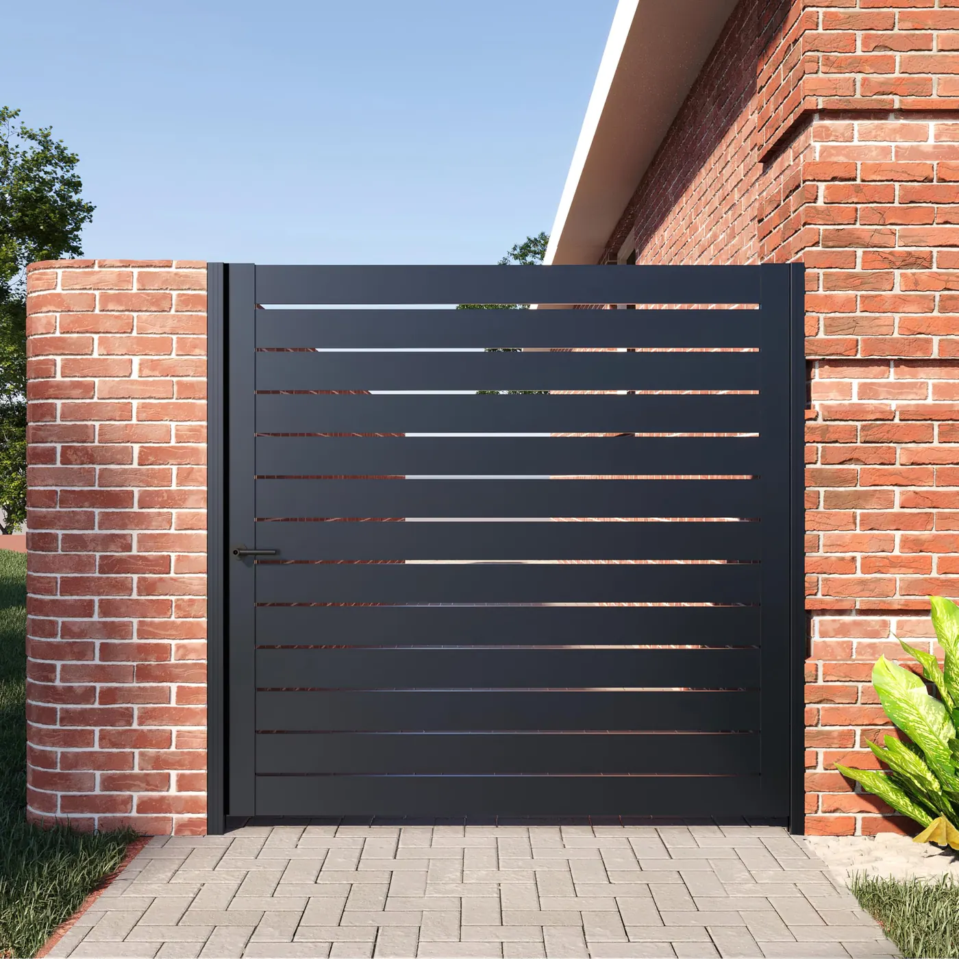 Modern black metal driveway gate with brick pillars